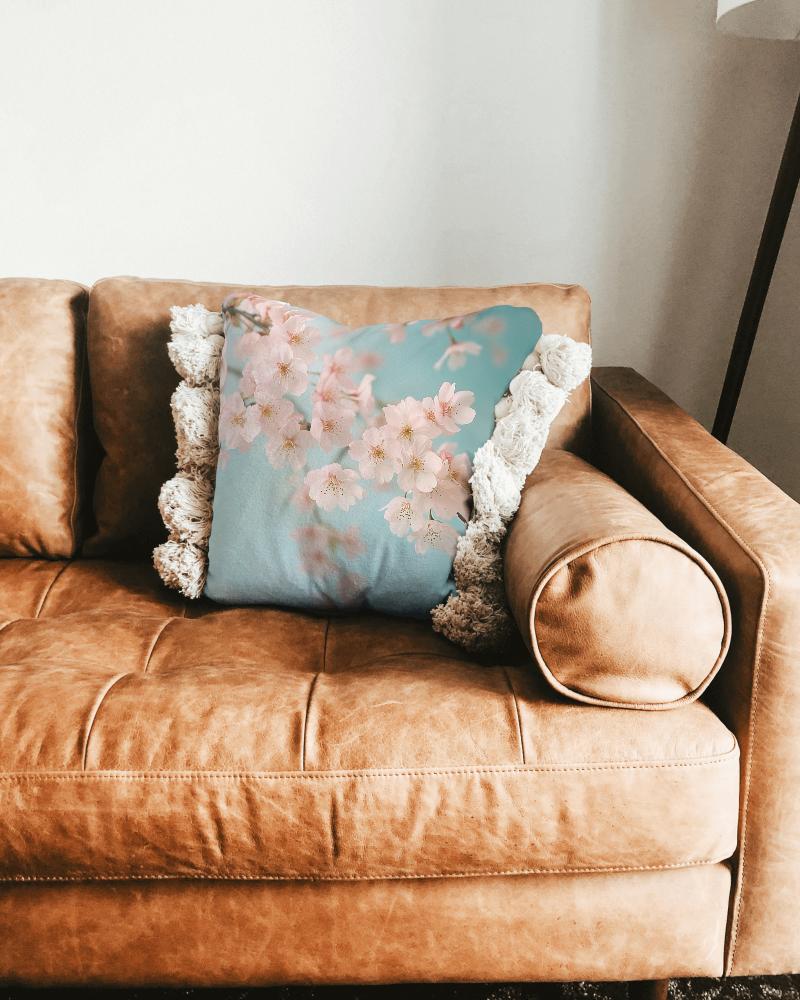Rustic Pillow Mockup On Leather Couch