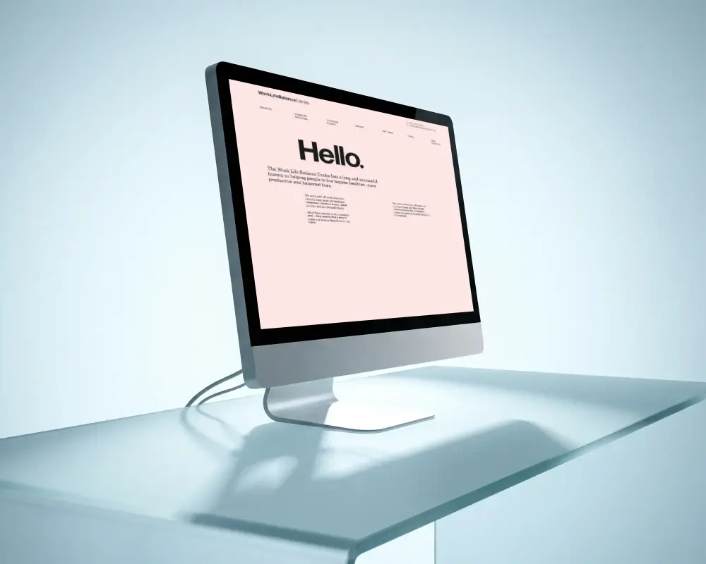 Sleek Modern Apple Desktop Monitor With Edge To Edge Screen Display On Clear Glass Table
