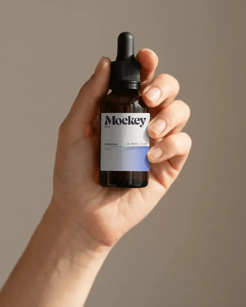 Minimalist Hand Held Dropper Bottle Mockup For Essential Oils And Serum Packaging Design