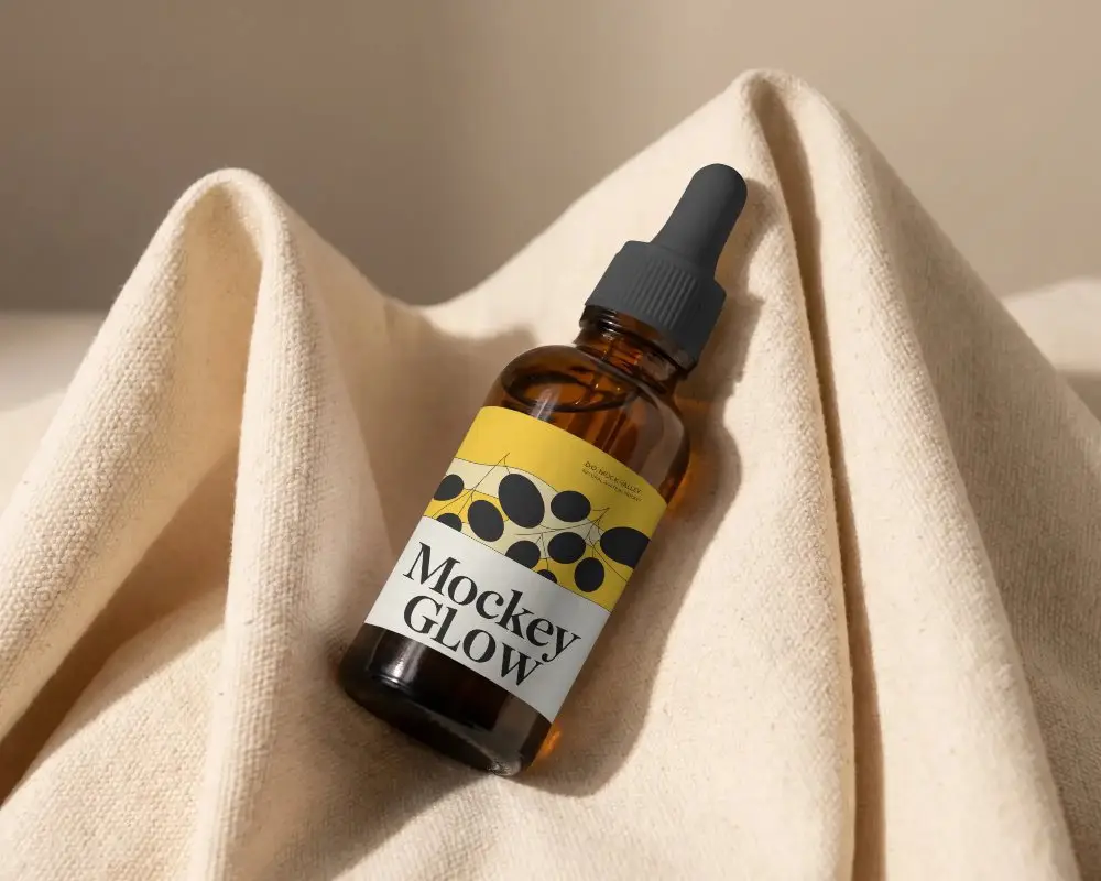 High Quality Droper Bottle Mockup On Textured Fabric Background For Brand Presentation
