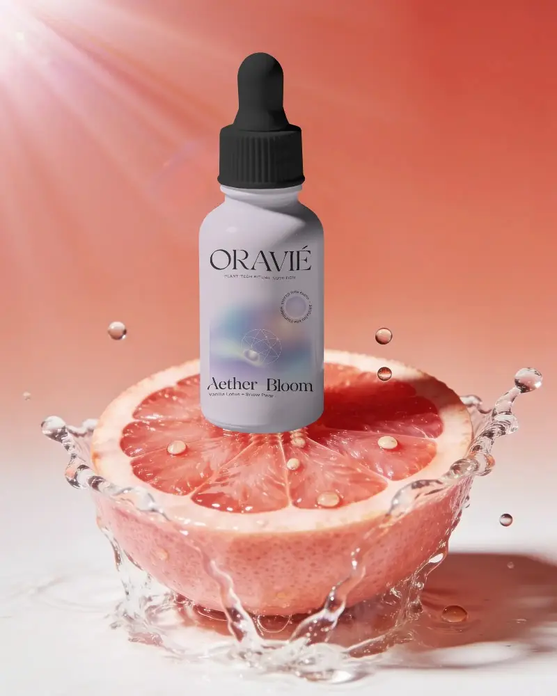 Premium Dropper Bottle Mockup Floating Over Vibrant Citrus Fruit With Water Splash Effect