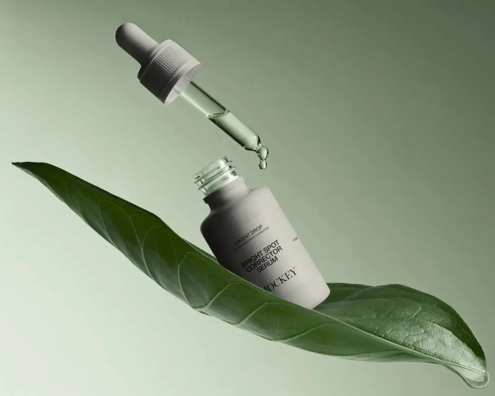 Dropper Bottle Mockup With Natural Leaf Background For Organic Skincare Product Presentation