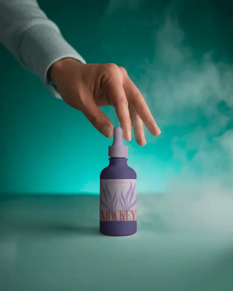 Hand Reach Dropper Bottle Mockup For Essential Oils Skincare Serum Packaging Presentations