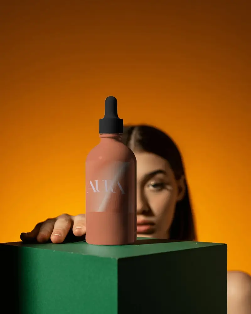 Minimal Dropper Bottle Mockup With Woman In Orange Background Modern Aesthetic