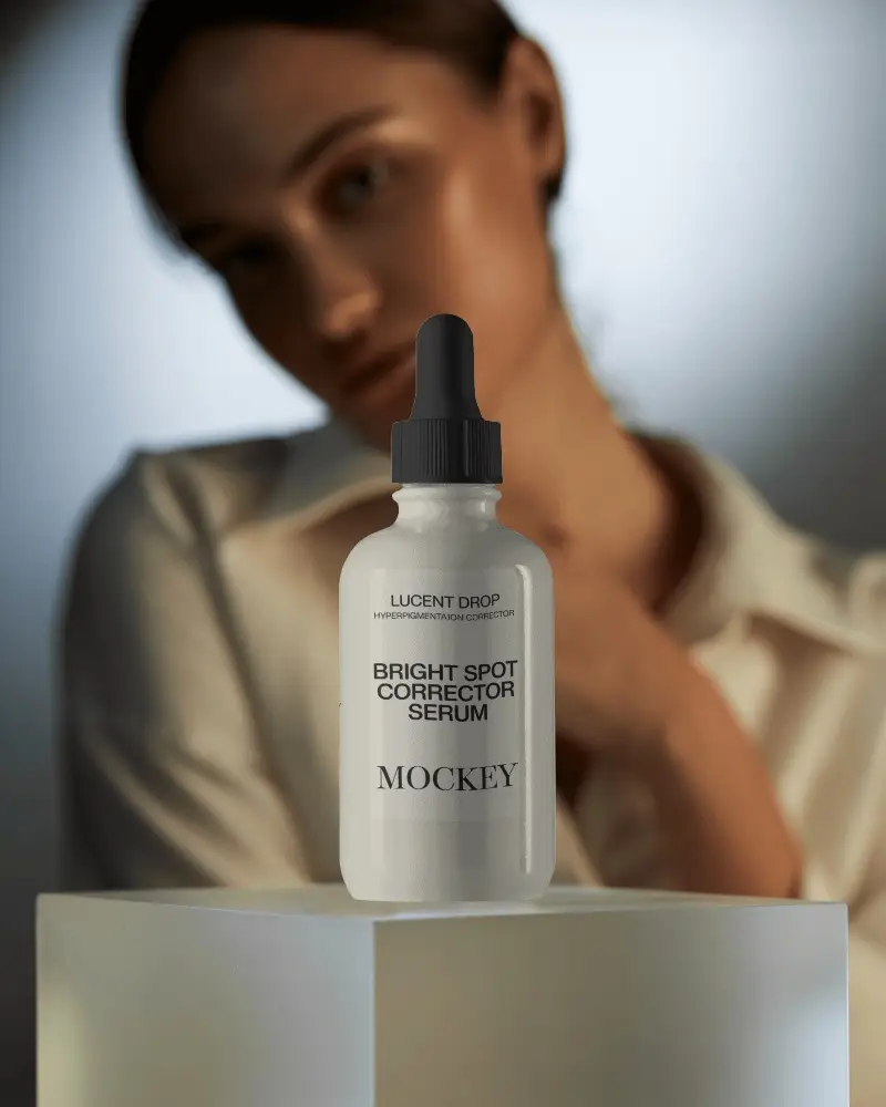 Elegant Dropper Bottle Mockup Minimal Studio Lighting With Soft Focus Model