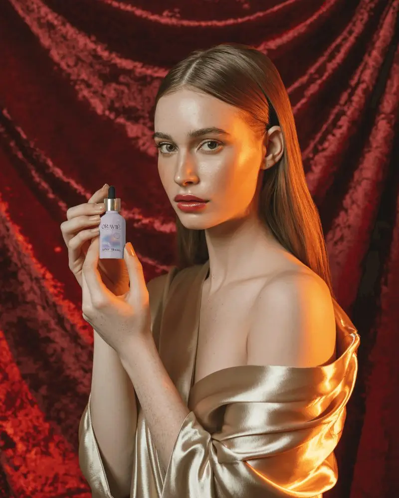 Luxury Dropper Bottle Mockup Golden Silk Aesthetic With Red Velvet Background