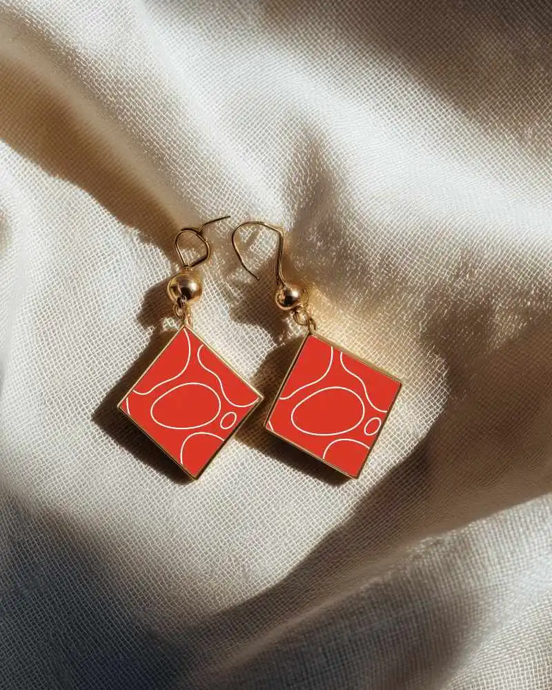 Sunlit Golden Drop Earring Mockup On Creased Luxury Fabric With Textured Cloth Highlights