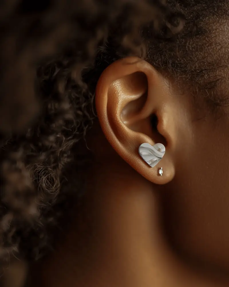 Close Up Jewelry Mockup Stud On Ear Model Dark Background Soft Focus Warm Tones Natural Lighting