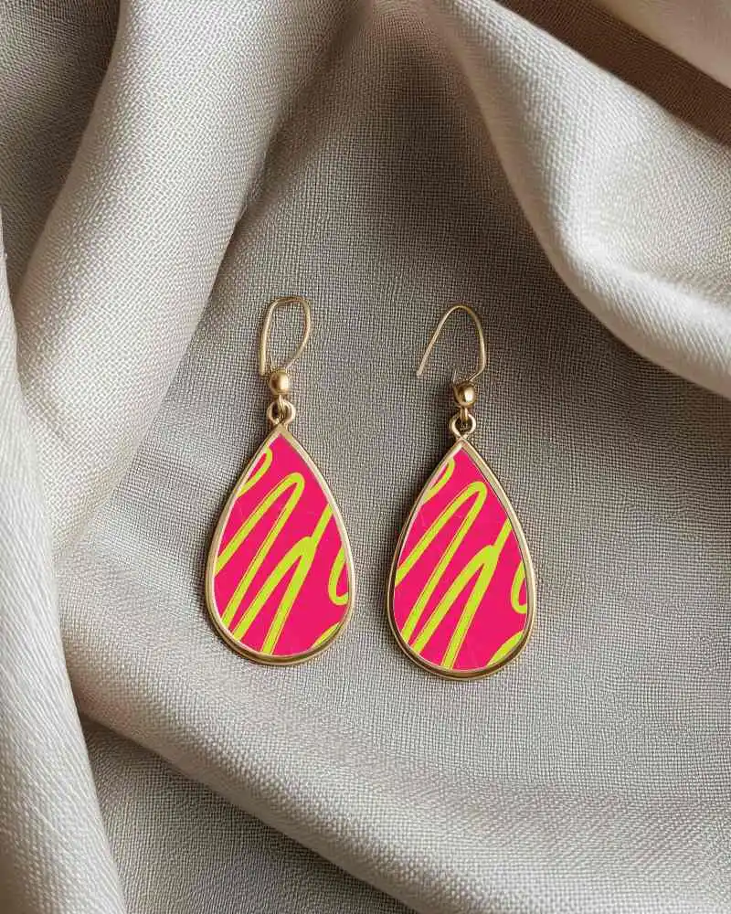 Golden Teardrop Earring Mockup With Green Center Resting On Soft Cream Fabric In Natural Light