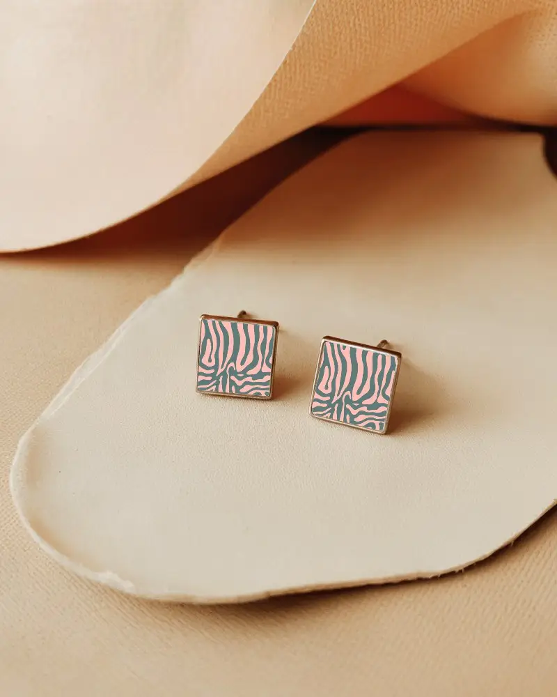 Minimalist Square Stud Earring Mockup With Black Center On Cream Leather Textured Surface