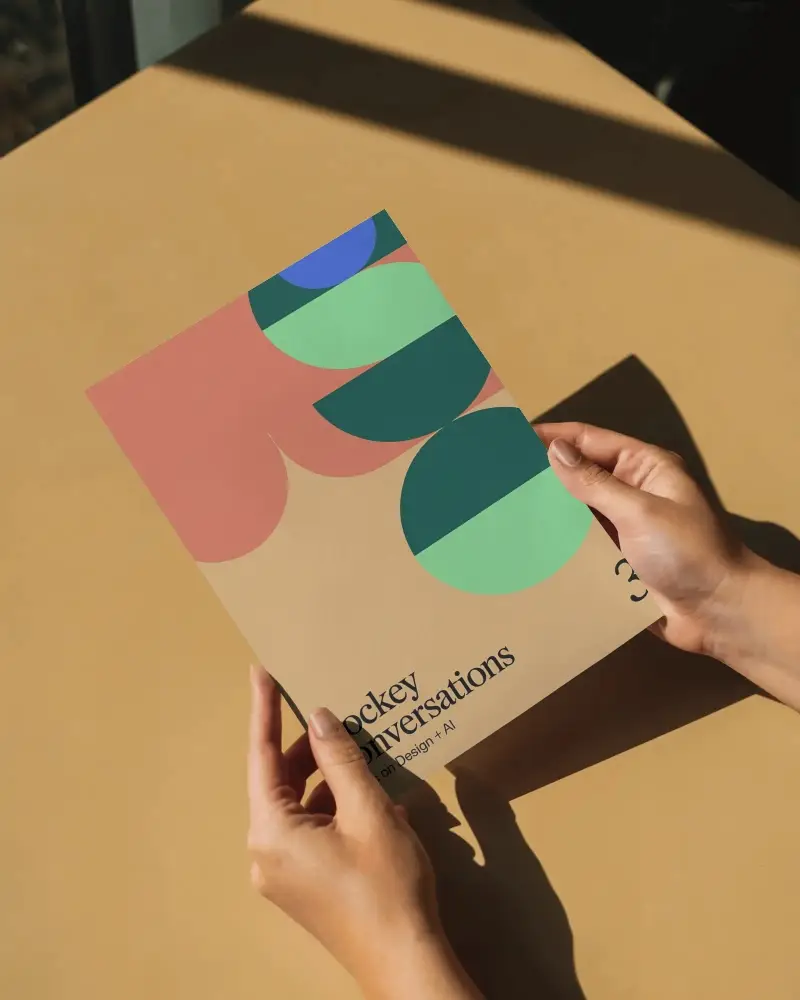 realistic-flyer-mockup-with-hand-holding-paper-in-natural-lightenvironment