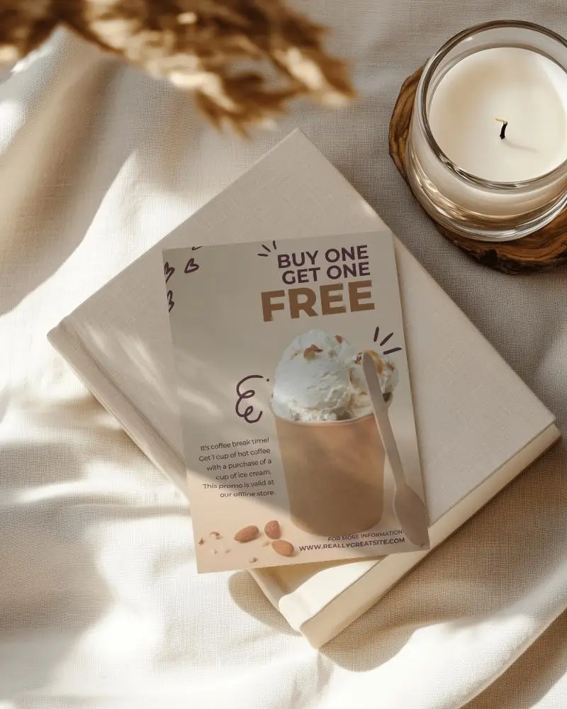 Cozy Aesthetic Flyer Mockup On Beige Book Stack With Candle And Fabric Light