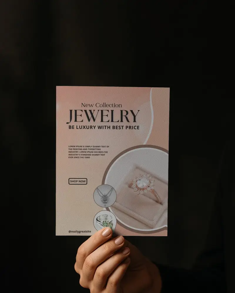 Hand Holding Portrait Flyer Mockup On Dark Backdrop With Human Touch Detail