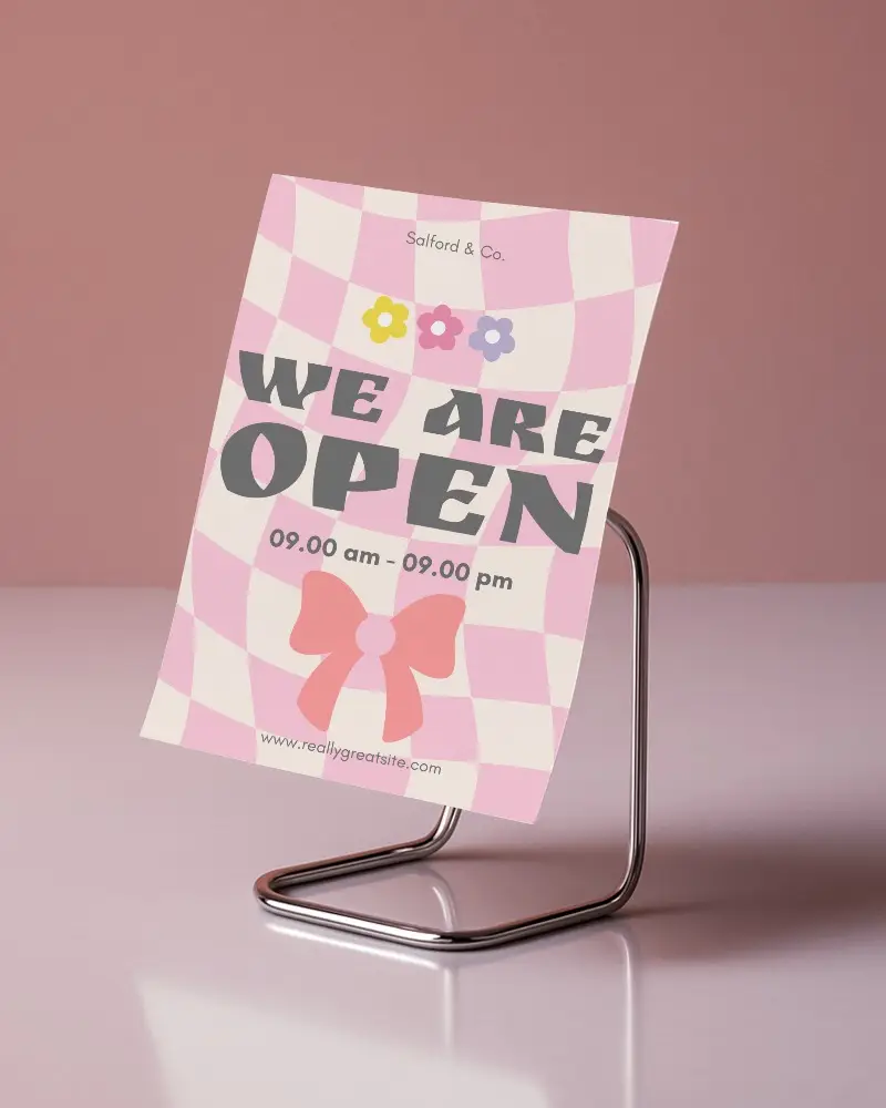 Pink Metallic Flyer Mockup Curved Sheet On Chrome Wire Stand With Glossy Reflection And Soft Rose Background