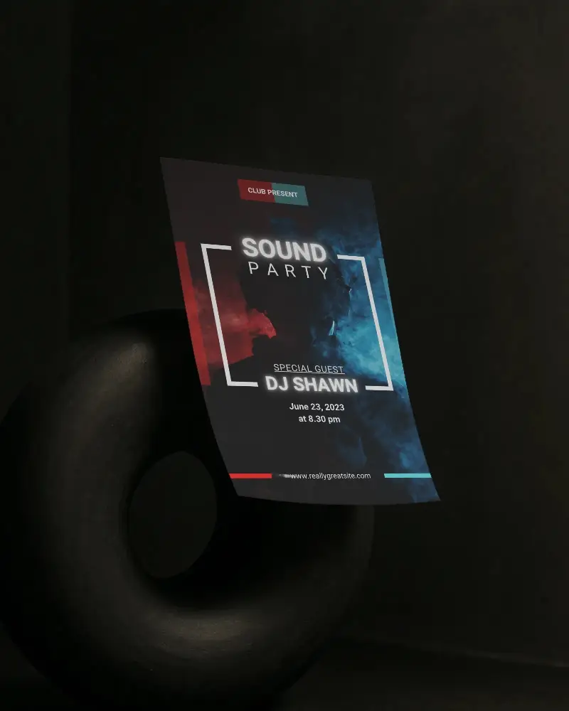 Curved Flyer Mockup Hovering Over Matte Black Sculpture Ring On Dark Backdrop With Soft Shadow Lighting