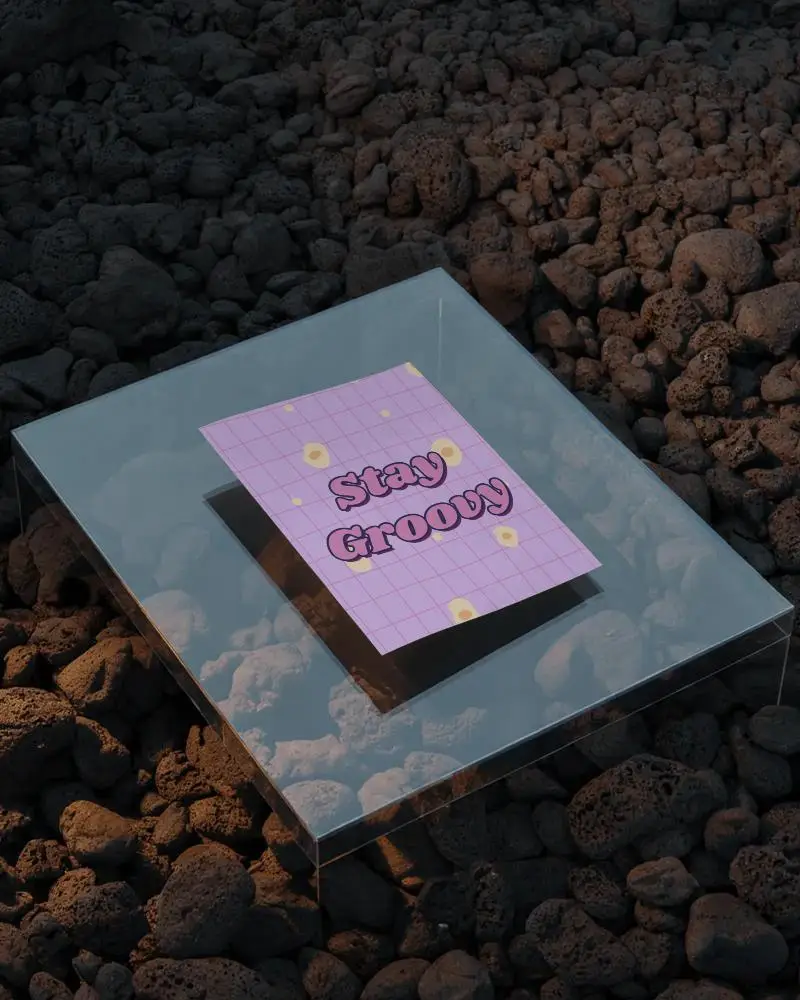 Layered Flyer Mockup On Glass Platform Over Volcanic Rocks With Evening Lighting And Shadow Depth