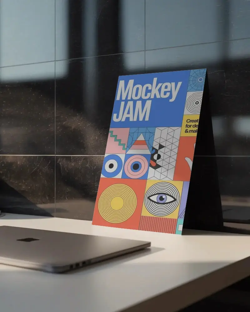 Vertical Flyer Mockup Standing On White Table Against Marble Tiled Wall Background