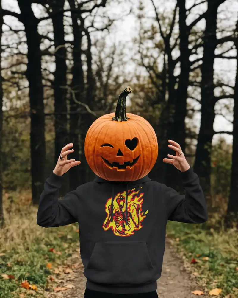 Spooky Halloween Hoodie Mockup With Jack O Lantern Head Wearing Hoodie In Forest Setting