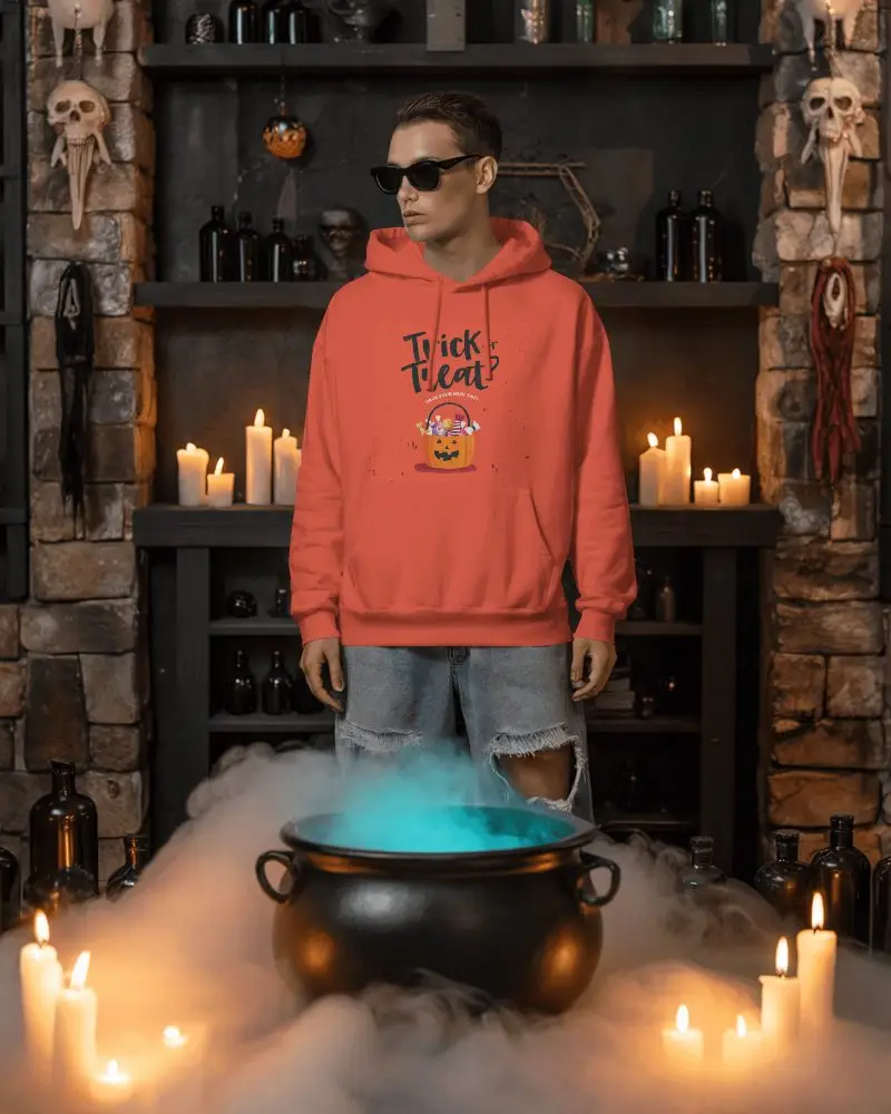 Edgy Halloween Mockup With Casual Fashion Standing Near A Mist Covered Witchs Cauldron