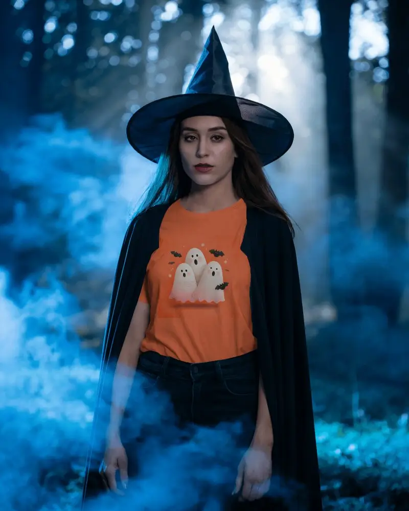 Enchanting Forest Witch In Halloween Tshirt Mockup And Hat Surrounded By Mystical Foggy Atmosphere