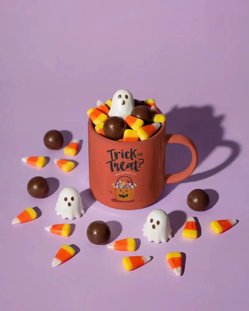 Halloween Candy Mug Mockup With Ghosts Chocolate Balls And Candy Corn Piled High