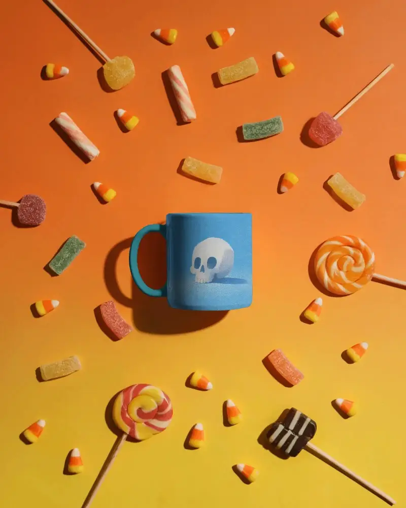 Spooky Halloween Mug Mockup With Scattered Candy For Seasonal Design