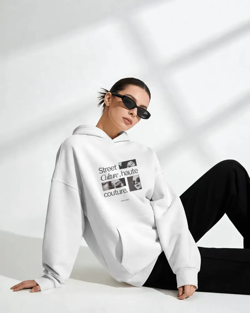 Oversized Hoodie Mockup With Female Sitting Relaxed Pose Soft Light Shadow Wall Modern Look