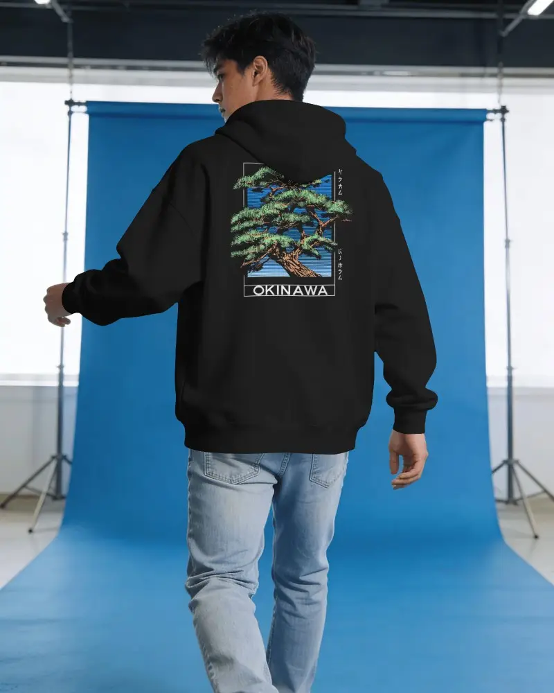 Amazon Hoodie Mockup Back View Male Model Walking In Studio With Blue Seamless Backdrop
