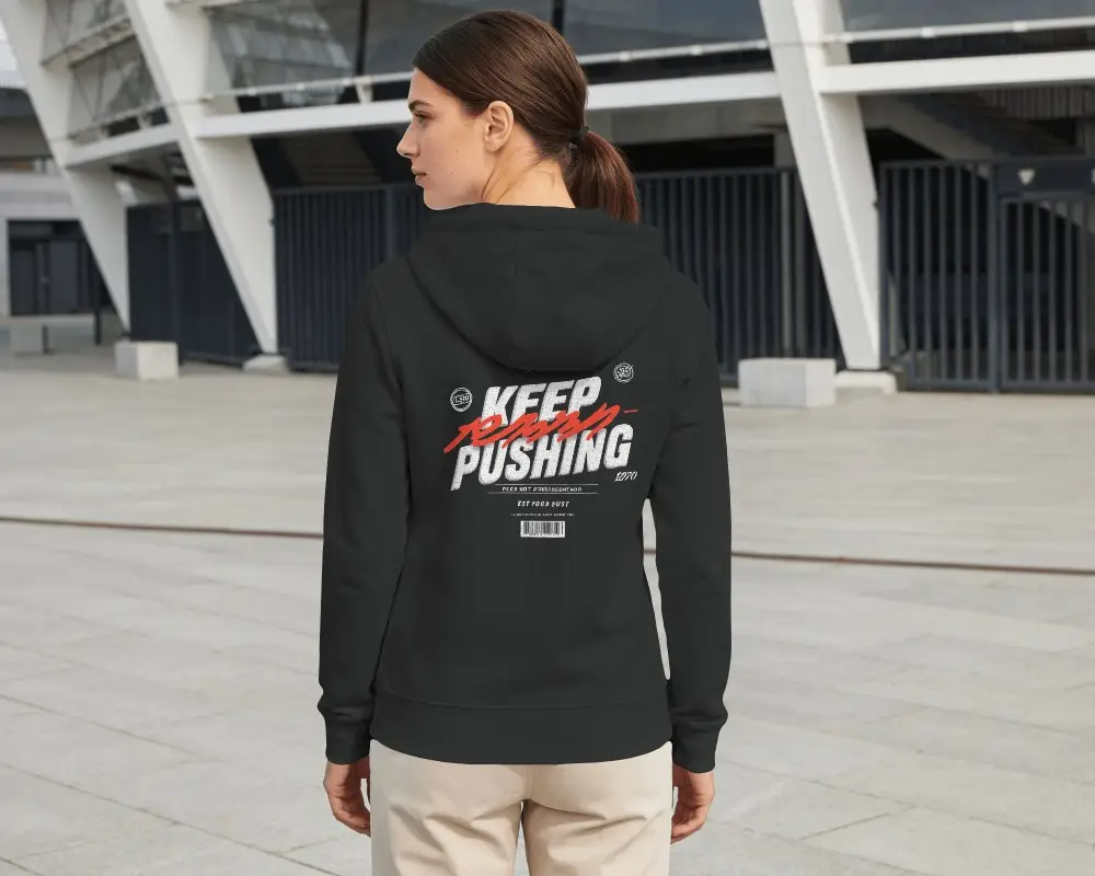 Back View Hoodie Mockup Female Model Standing In Modern Architectural Urban Outdoor Setting