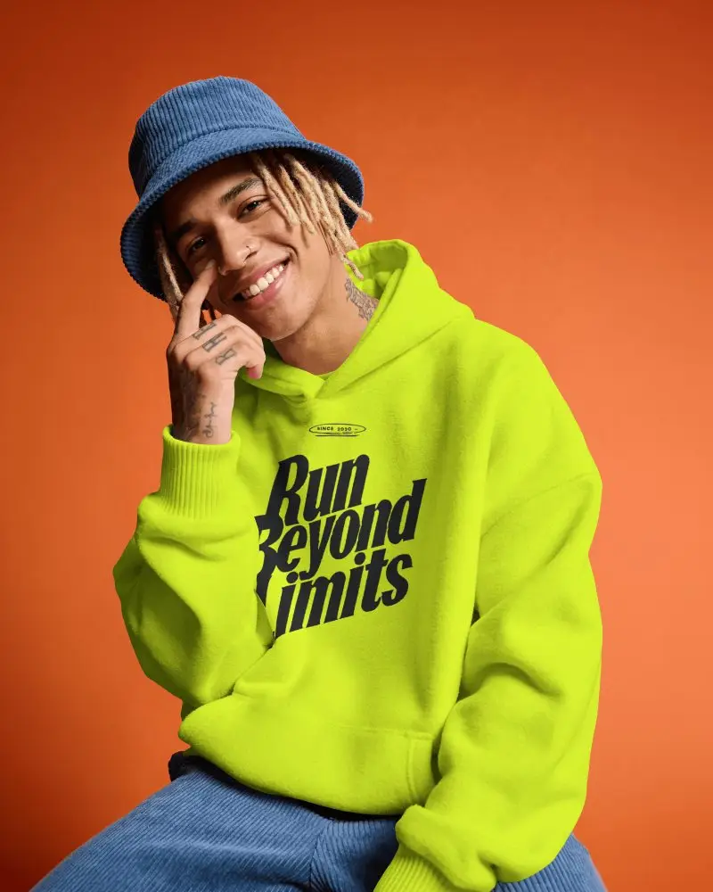 Orange Studio Hoodie Mockup Male Model Smiling With Bucket Hat And Relaxed Friendly Expression