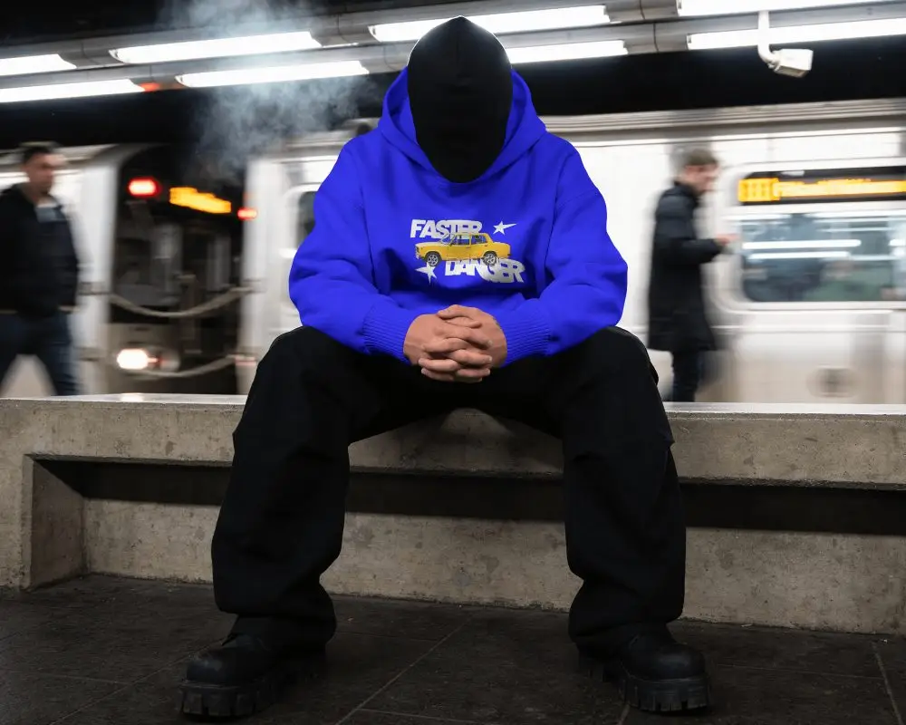 Hoodie Mockup Faceless Model Sitting On Concrete Bench With Moving Train Background