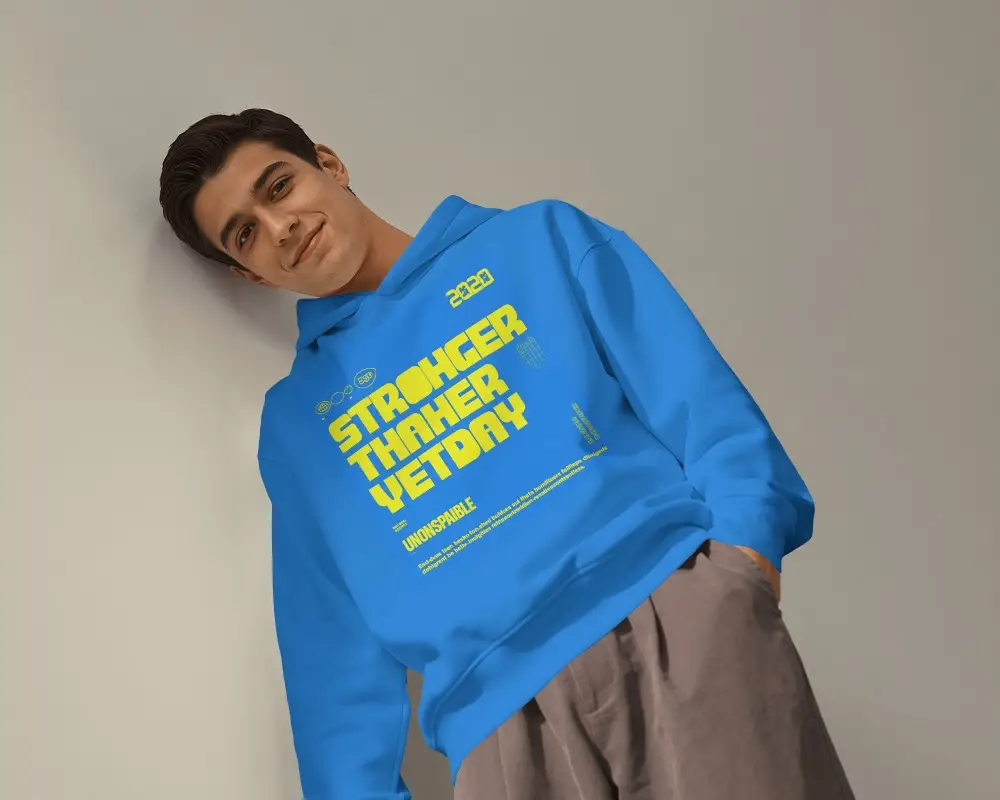 Low Angle Mens Hoodie Mockup With Male Model Leaning Sideways And One Hand In Pocket