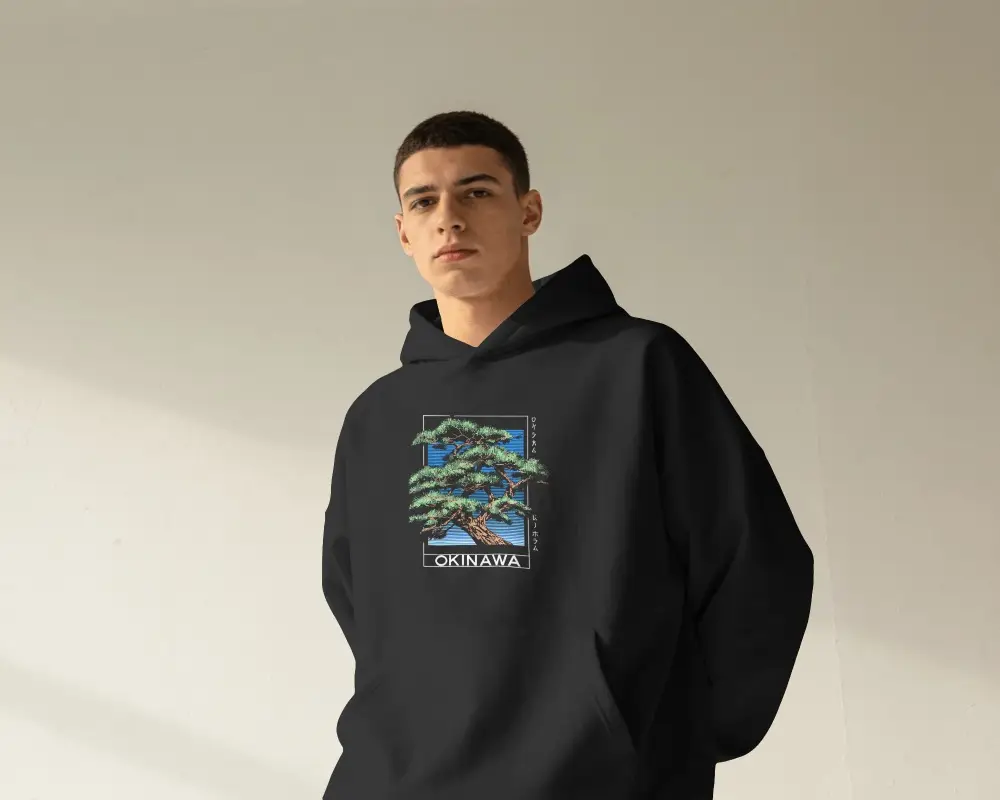 Sunlit Mens Hoodie Mockup With Buzz Cut Model Standing Front Facing Against Minimal Textured Wall