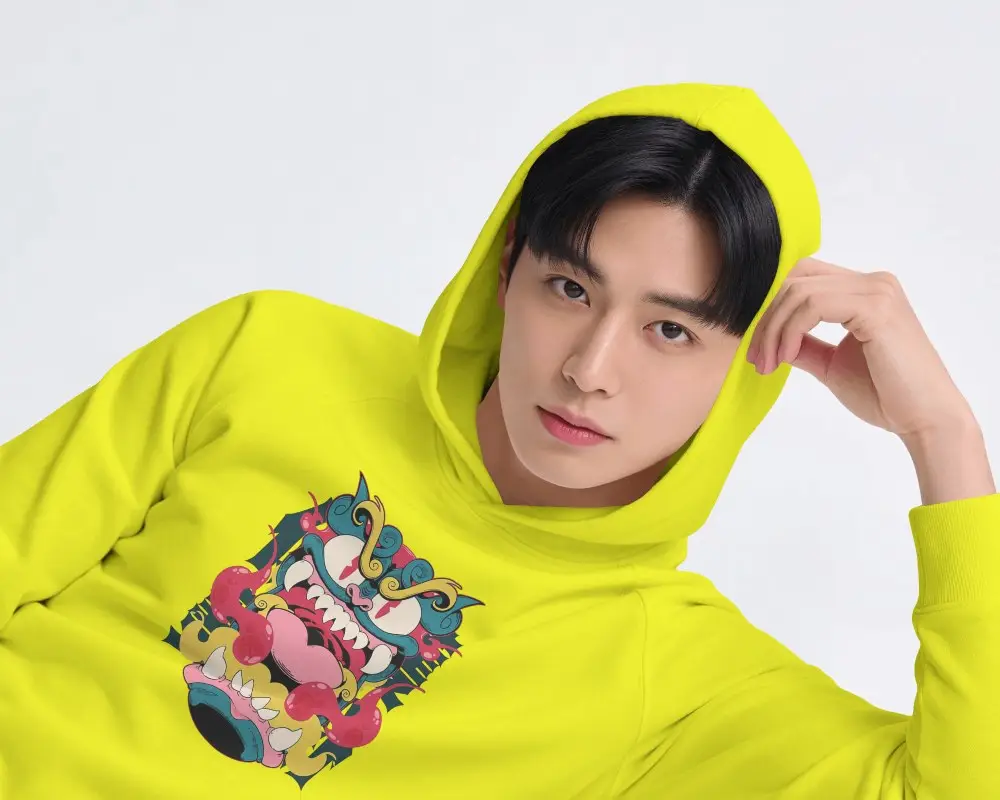 Reclining Mens Hoodie Mockup With Hood Up And Model Resting Head On Hand In Clean Studio