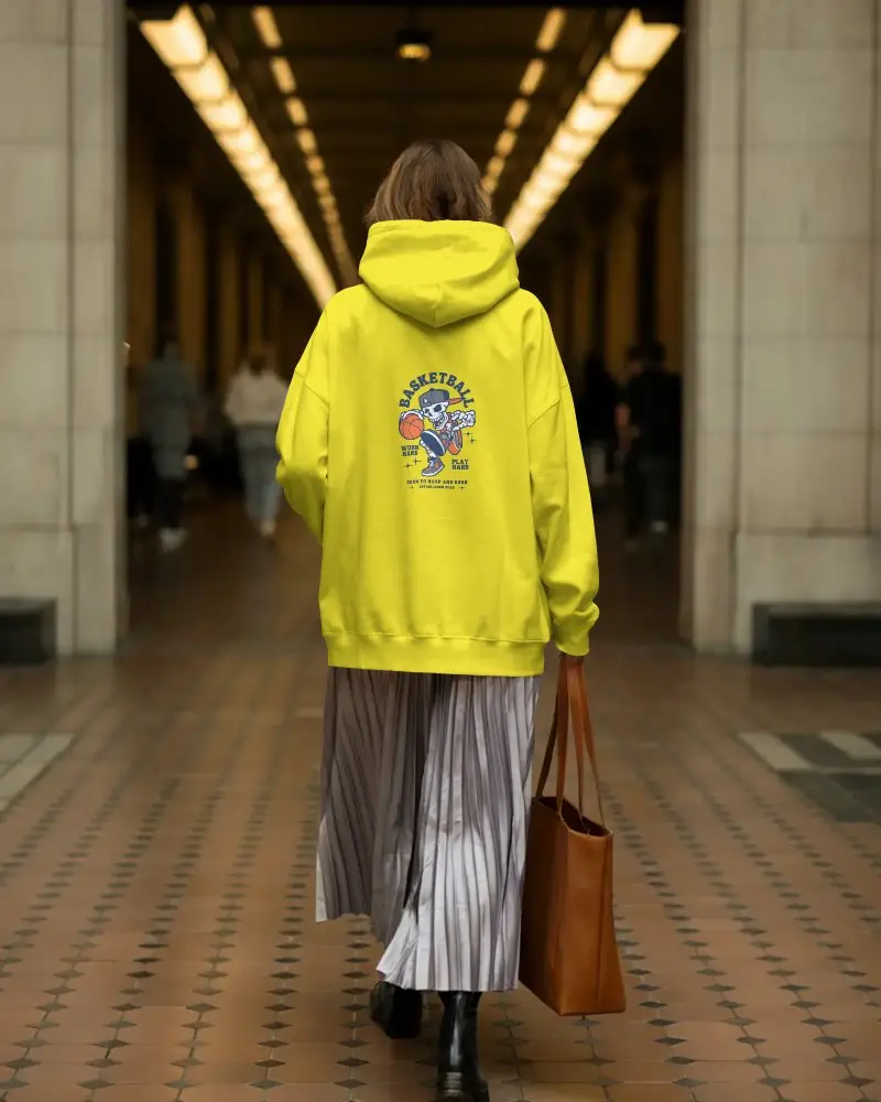 Street Style Back View Of Female Model Wearing Hoodie Mockup And Boots In Architectural Passageway