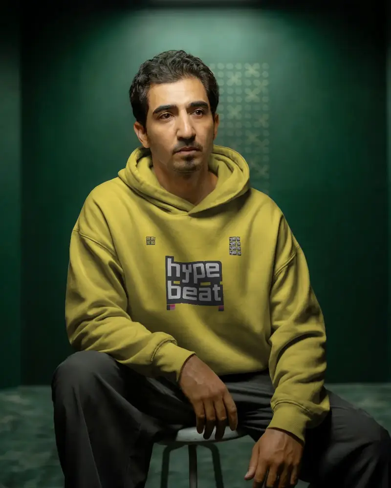 Comfortable Relaxed Fit Hoodie Mockup For Men Sitting Casual Style Studio Shoot