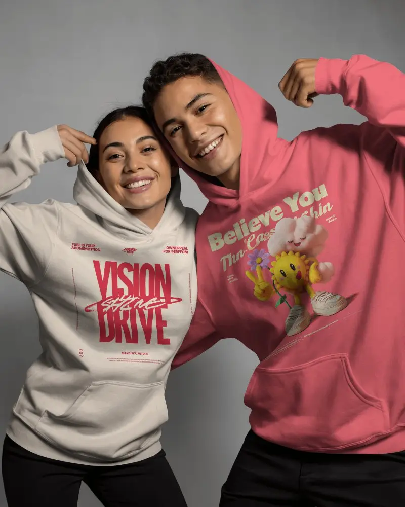 Playful Couple Hoodie Mockup Showing Joyful Expressions In Studio With Modern Casual Style