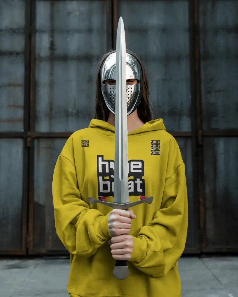 Cinematic Hoodie Mockup With Metallic Mask And Sword Styled In Dark Industrial Backdrop