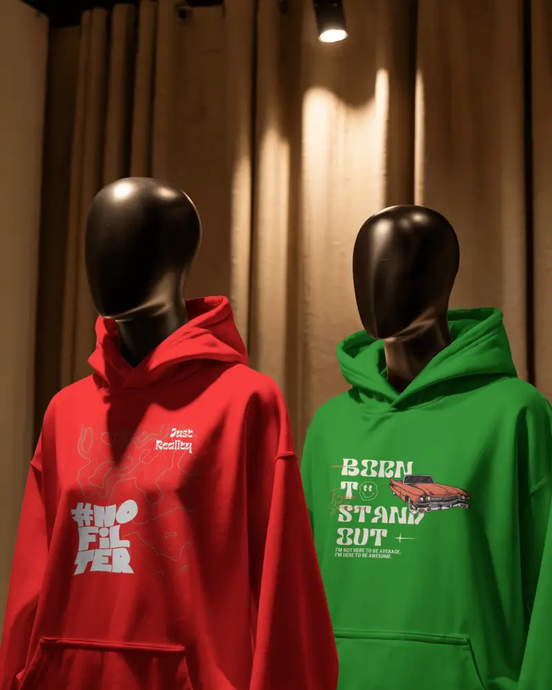 Boutique Display Hoodie Mockup Two Mannequins Under Spotlight Warm Toned Curtain Backdrop