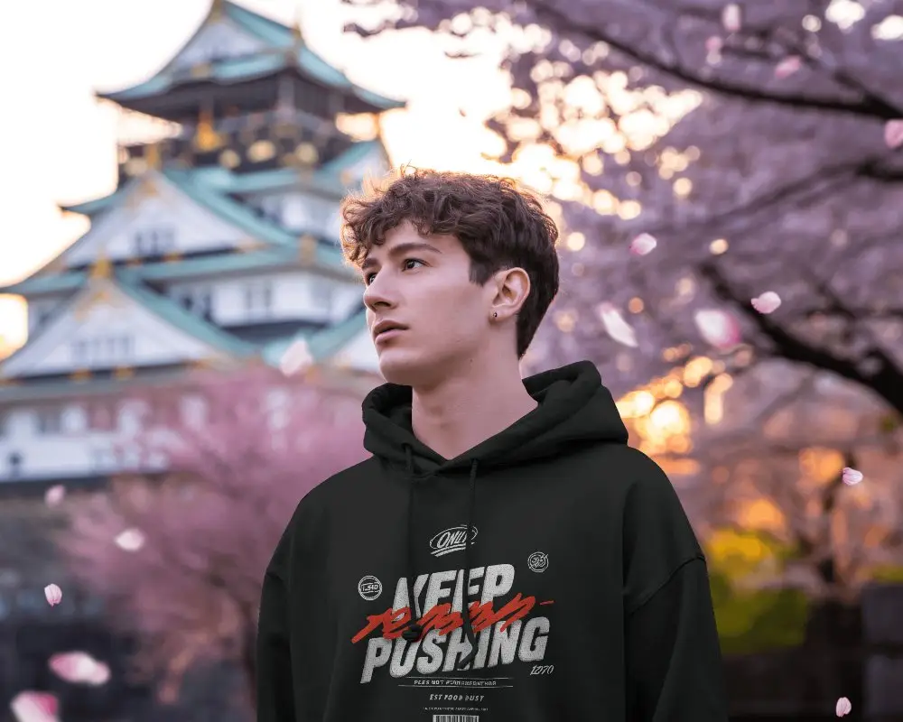 Hoodie Mockup Male Model In Cherry Blossom Season With Japanese Castle Background