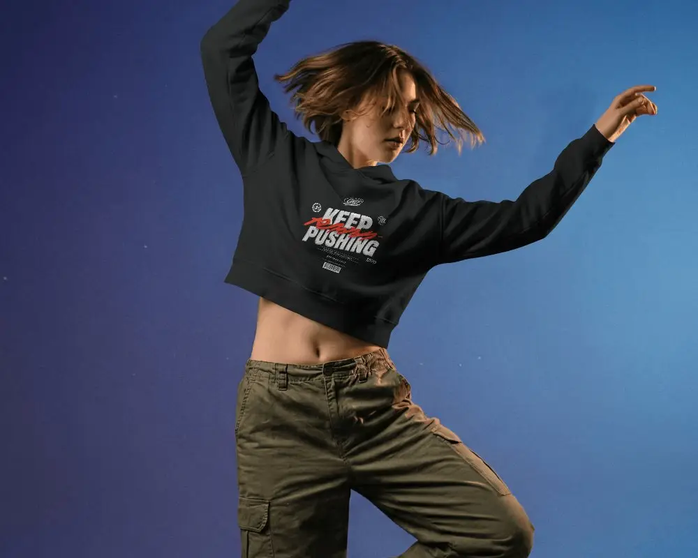 Dynamic Action Hoodie Mockup Female Model Dancing In Motion Against Bold Gradient Background
