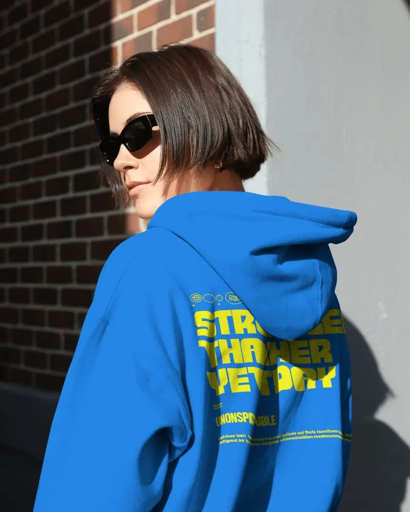 Brick Wall Street Hoodie Mockup Female Model Wearing Sunglasses In Sharp Sunlight
