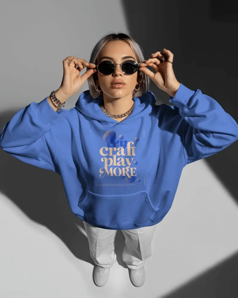 Top View Studio Hoodie Mockup Model Adjusting Sunglasses In Strong Light