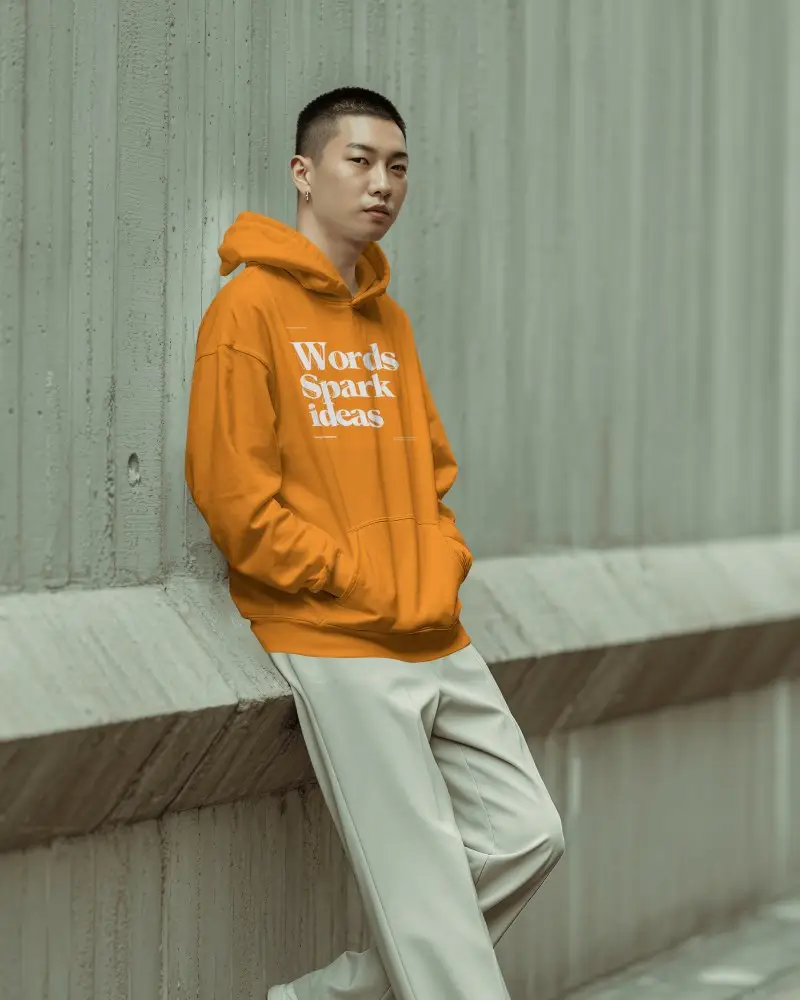 Minimal Concrete Wall Hoodie Mockup Male Model Leaning Outdoor Setting