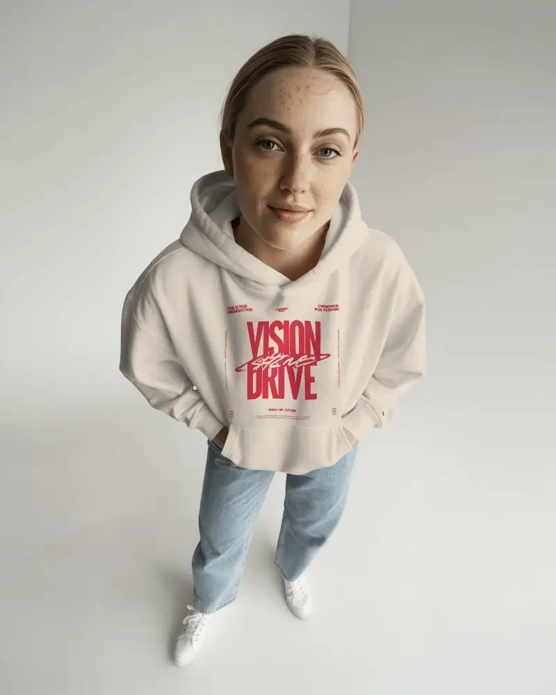 High Angle Studio Hoodie Mockup Female Model Standing On Clean Floor