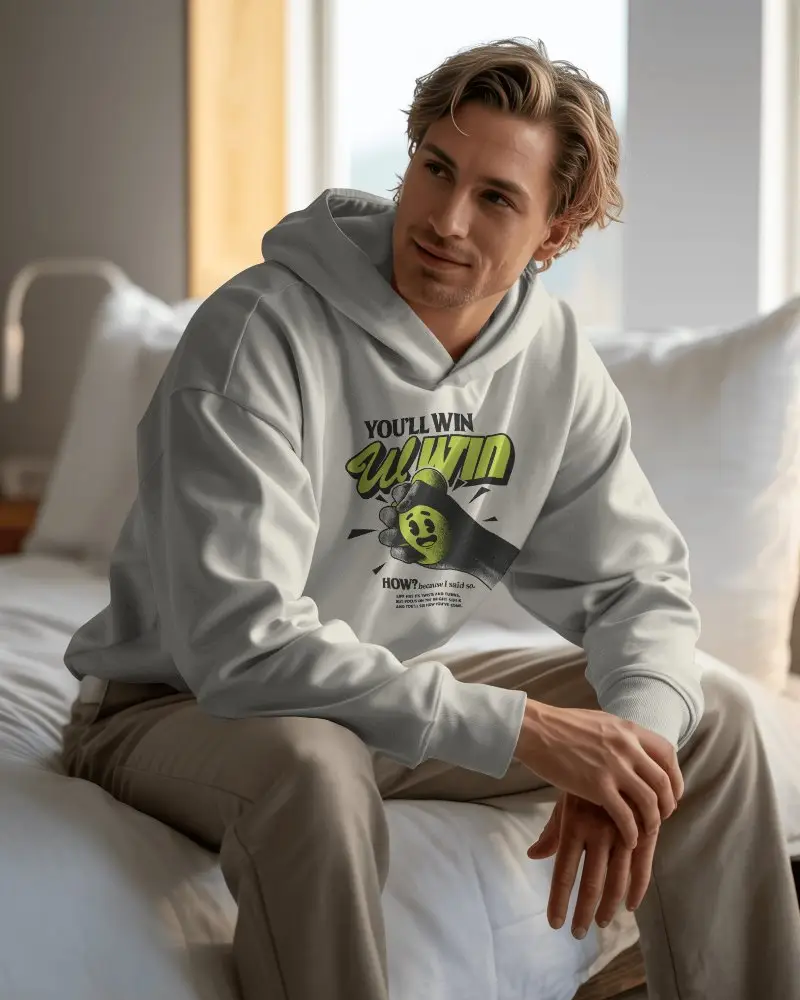 Natural Window Light Hoodie Mockup Man In Relaxed Interior Setting Sitting Casually
