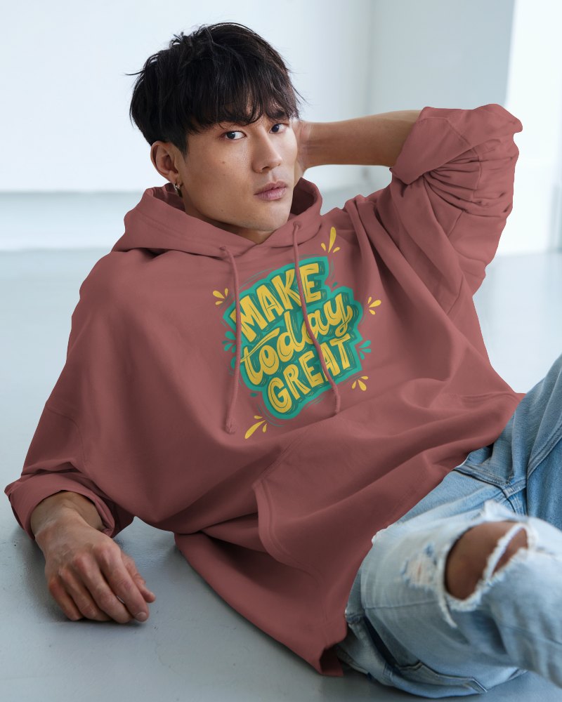 Relaxed Fit Hoodie Mockup Male Model Leaning Back In Bright Room Casual And Trendy Look