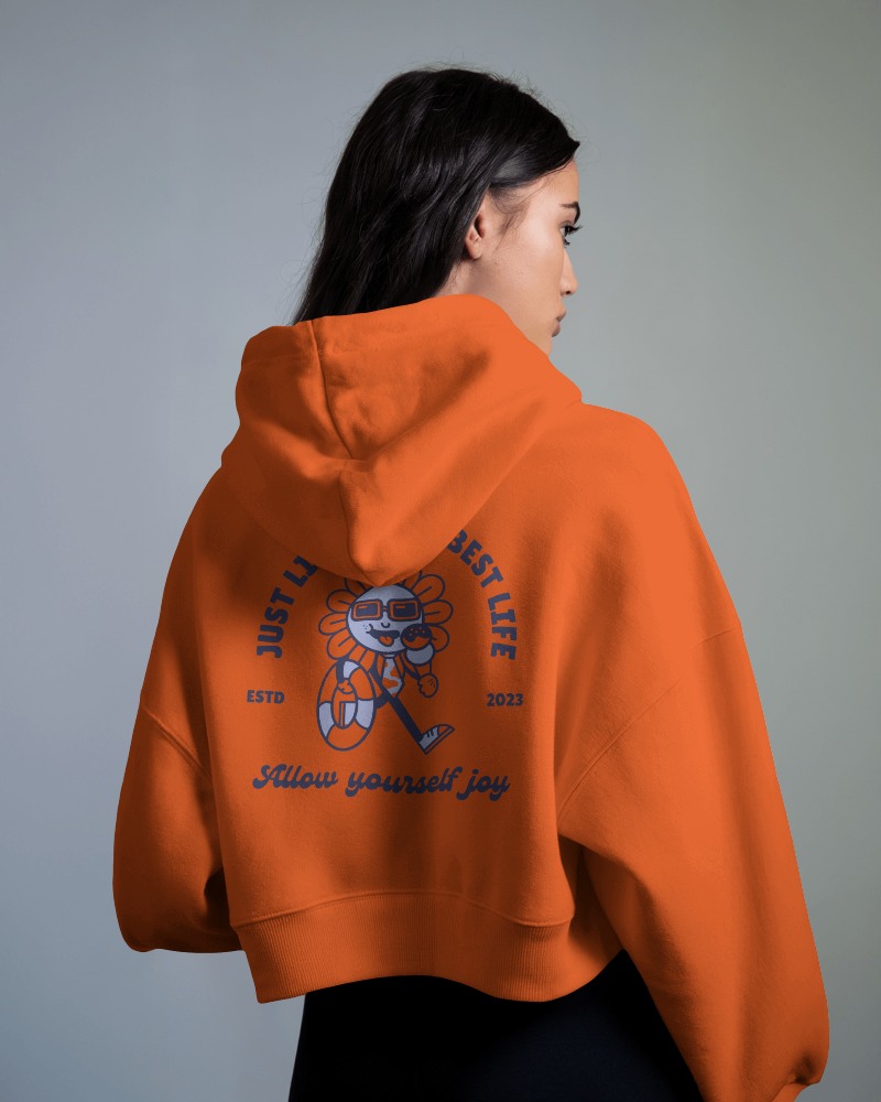 Vibrant Orange Cropped Hoodie Mockup Female Model Side Profile Playful Graphic Design