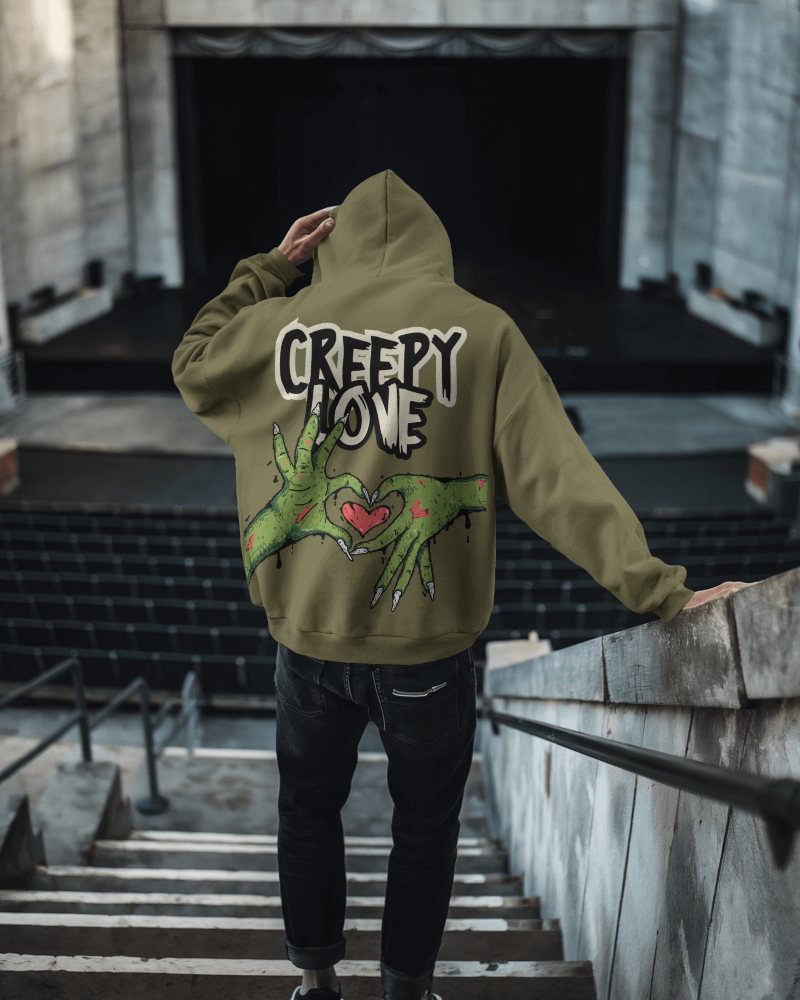 Gritty Cityscape Hoodie Mockup Male Model With Haunting Horror Design In Dystopian Backdrop