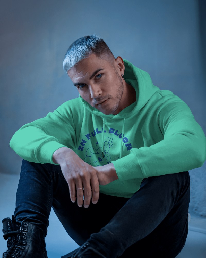 Vibrant Plant Graphic On Lime Hoodie Mockup Male Model Emphasizing Unique Casual Wear